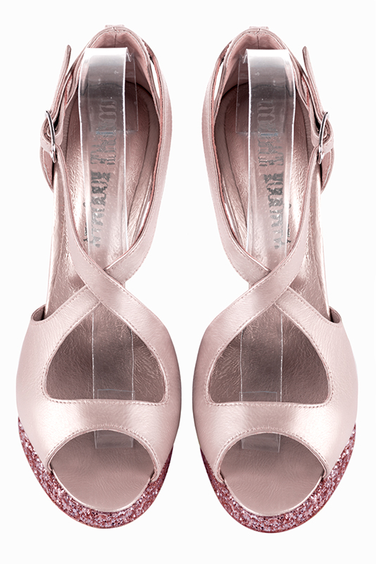 Light pink women's closed back sandals, with crossed straps. Round toe. Very high slim heel with a platform at the front. Top view - Florence KOOIJMAN